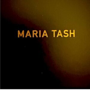 Maria Tash floating pear shaped diamond stud earring in 18 karat gold.